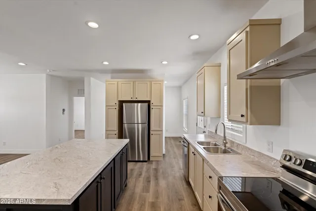 a kitchen with a sink stove and cabinets