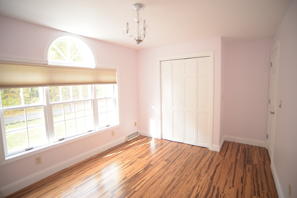 1436 Morgan Road West Springfield, MA 01089 - Photo 23 of 30 a view of an empty room with wooden floor and a window
