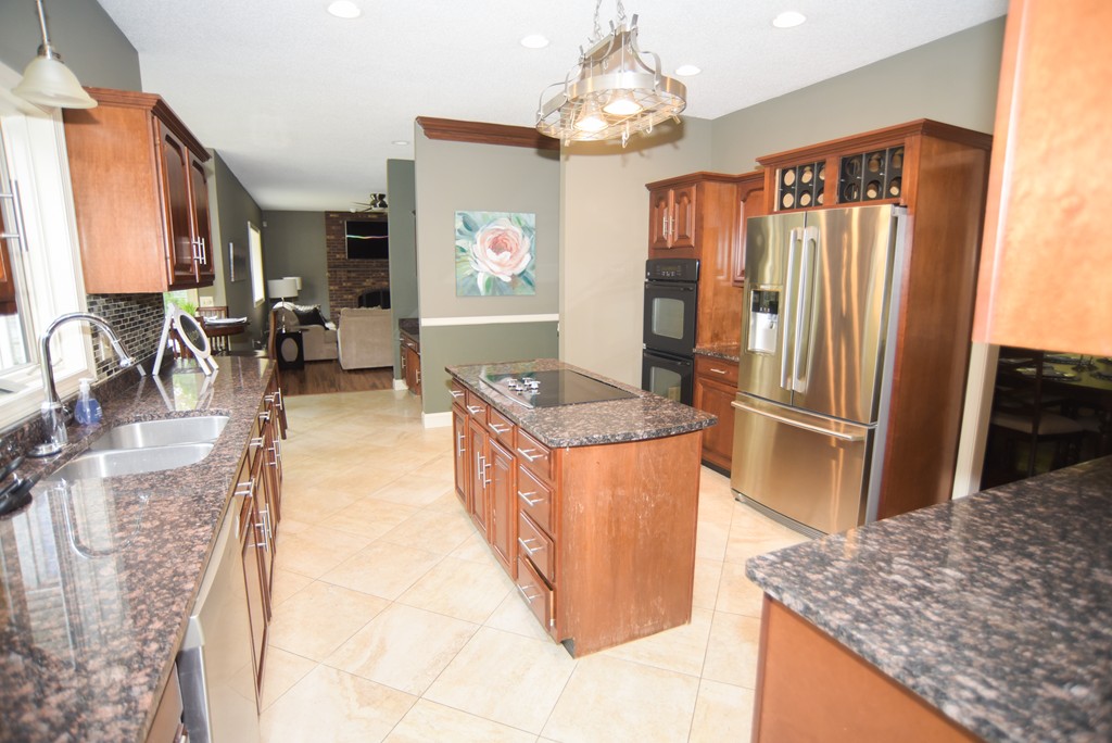 1436 Morgan Road West Springfield, MA 01089 - Photo 9 of 30 a kitchen with granite countertop a refrigerator stove and sink