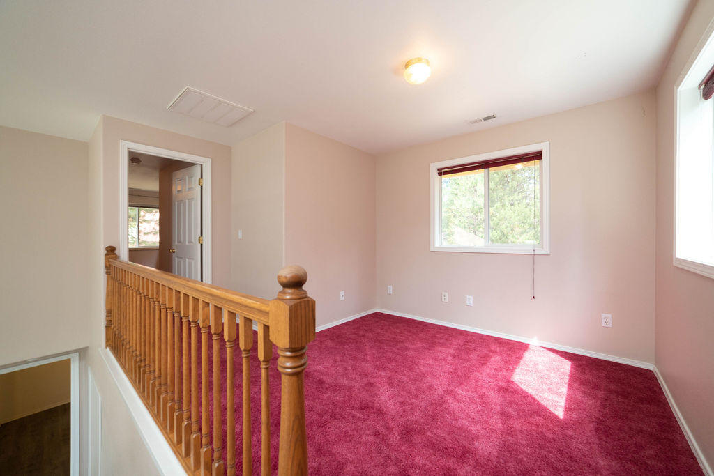 16944 Downey Road Bend, OR 97707 - Photo 24 of 44 a view of an empty room with wooden floor and a window