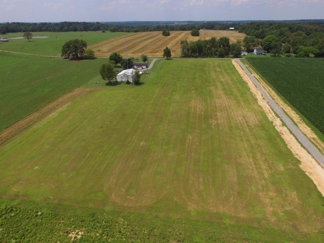 0 Swann Road Cross Plains, TN 37049 - Photo 6 of 15 a view of a lake with a big yard