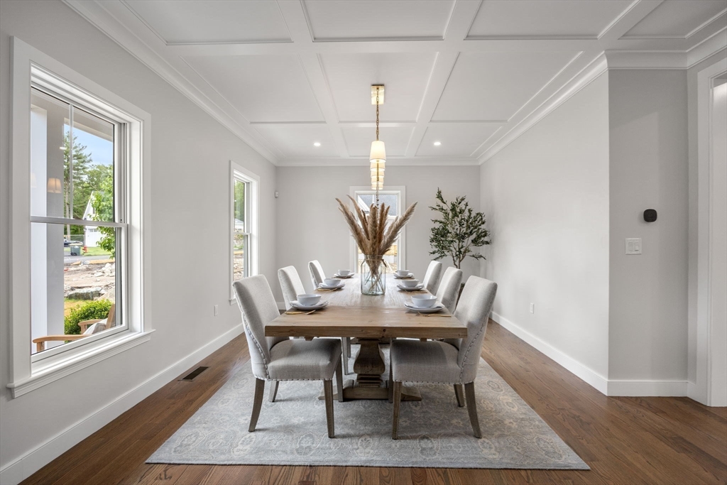 80 Horrigan Drive, Unit 24 Dedham, MA 02026 - Photo 13 of 28 a view of a dining room with furniture and wooden floor