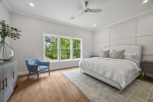 a bedroom with a bed and a chair