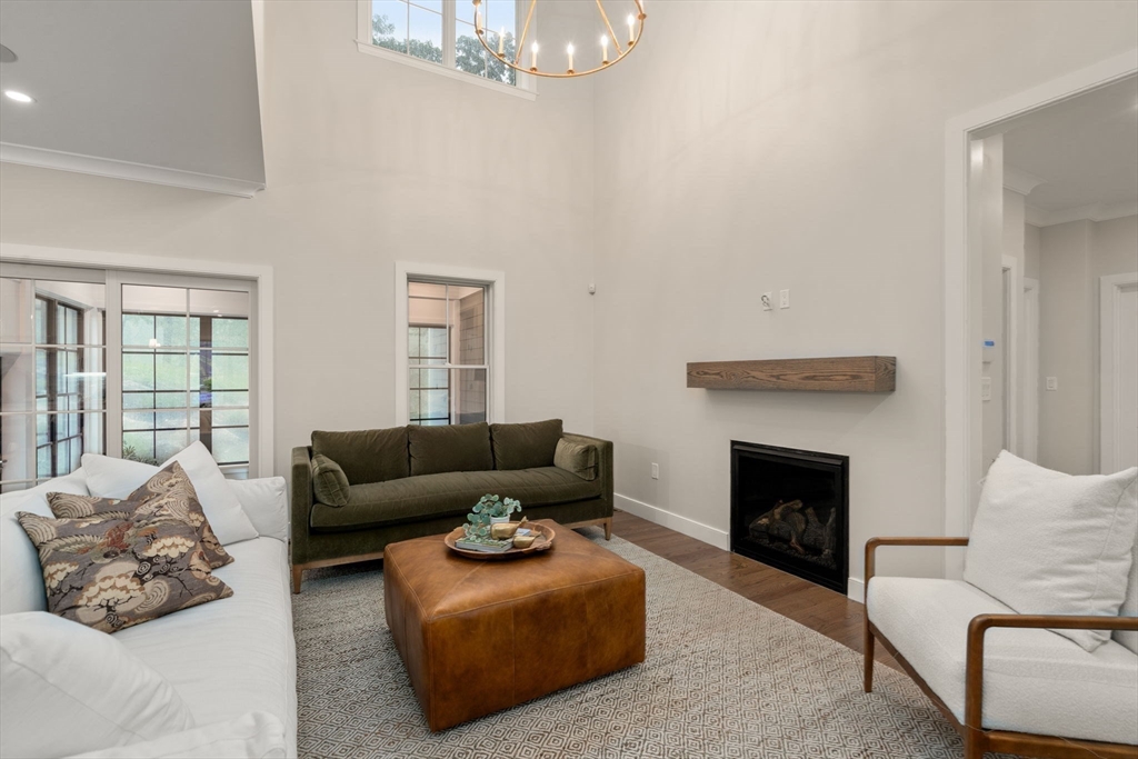 80 Horrigan Drive, Unit 24 Dedham, MA 02026 - Photo 8 of 28 a living room with furniture and a fireplace