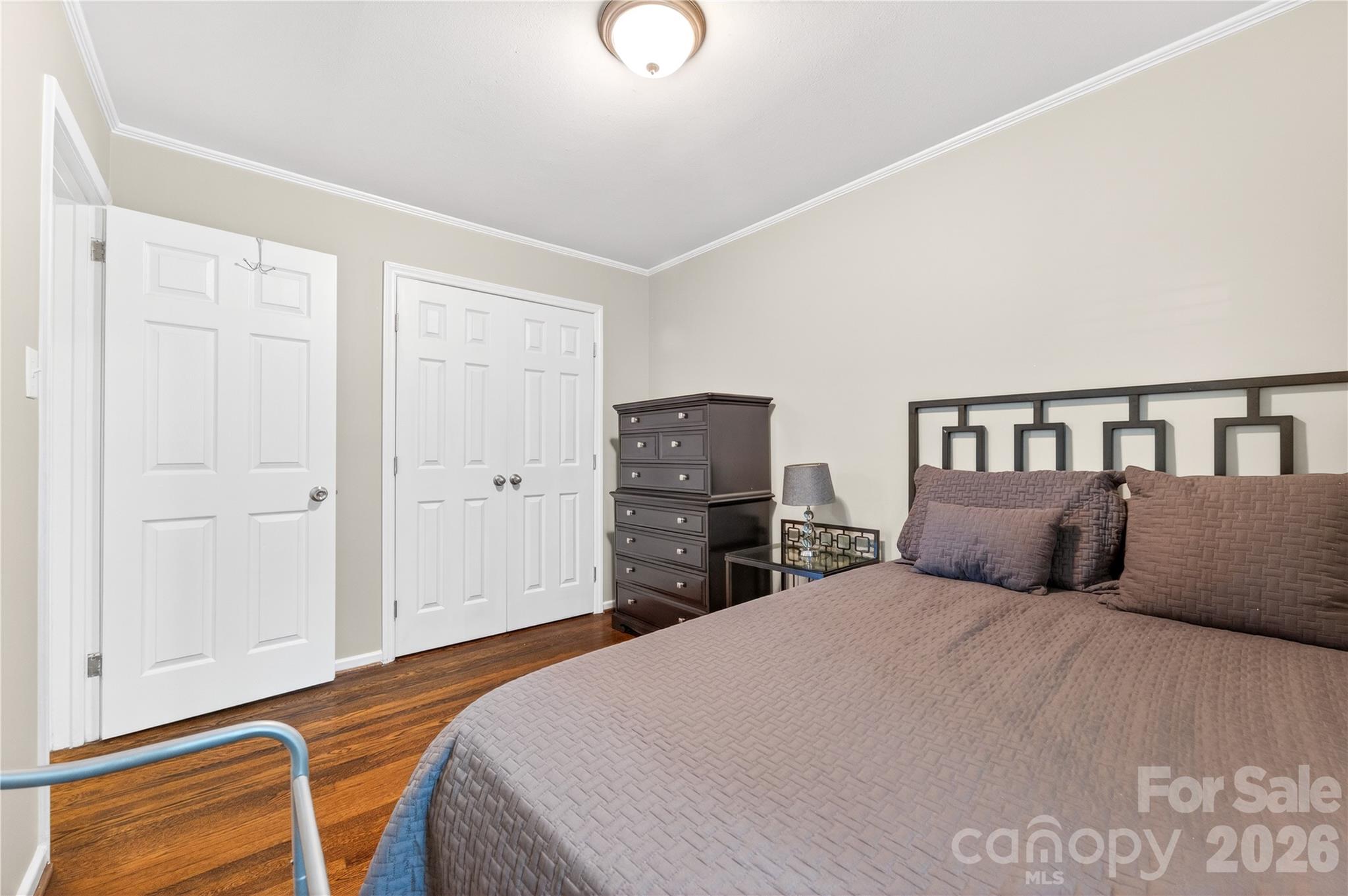 3241 Minnesota Road Charlotte, NC 28208 - Photo 15 of 18 a bedroom with a bed and closet