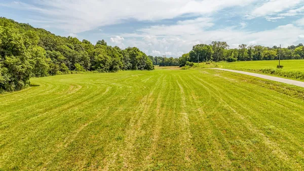 a view of a swimming pool with an outdoor space and seating area