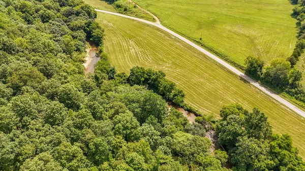 a view of a large body of water with a building in the background