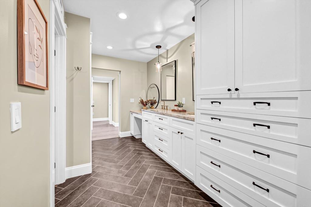1760 Gascony Road Encinitas, CA 92024 - Photo 22 of 49 a bathroom with a double vanity sink mirror and