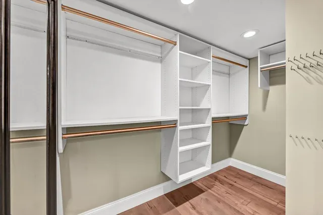 a view of an entryway with wooden floor and stairs