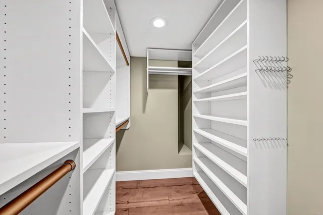 a bathroom with a shower sink vanity mirror and toilet