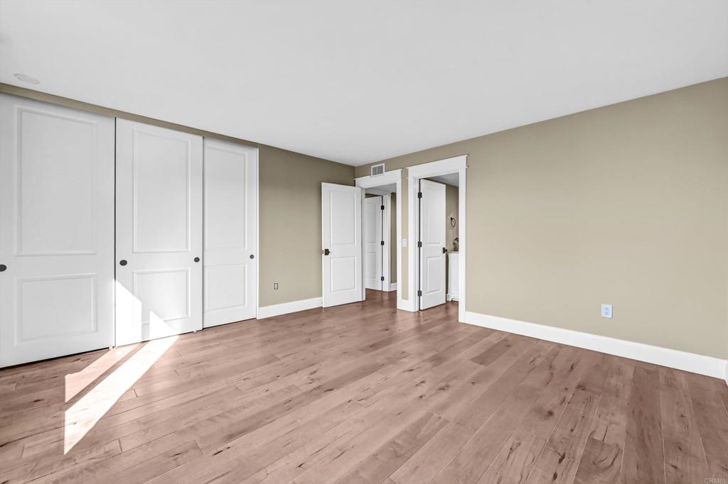 1760 Gascony Road Encinitas, CA 92024 - Photo 31 of 49 a view of an empty room and wooden floor