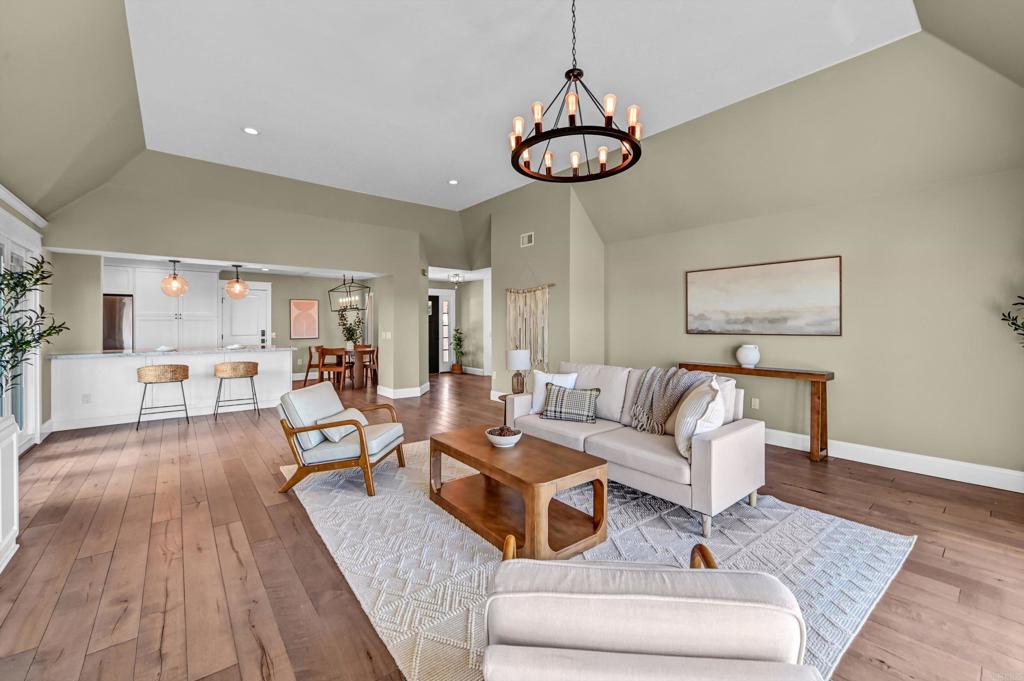 1760 Gascony Road Encinitas, CA 92024 - Photo 10 of 49 a living room with furniture a couch and a chandelier