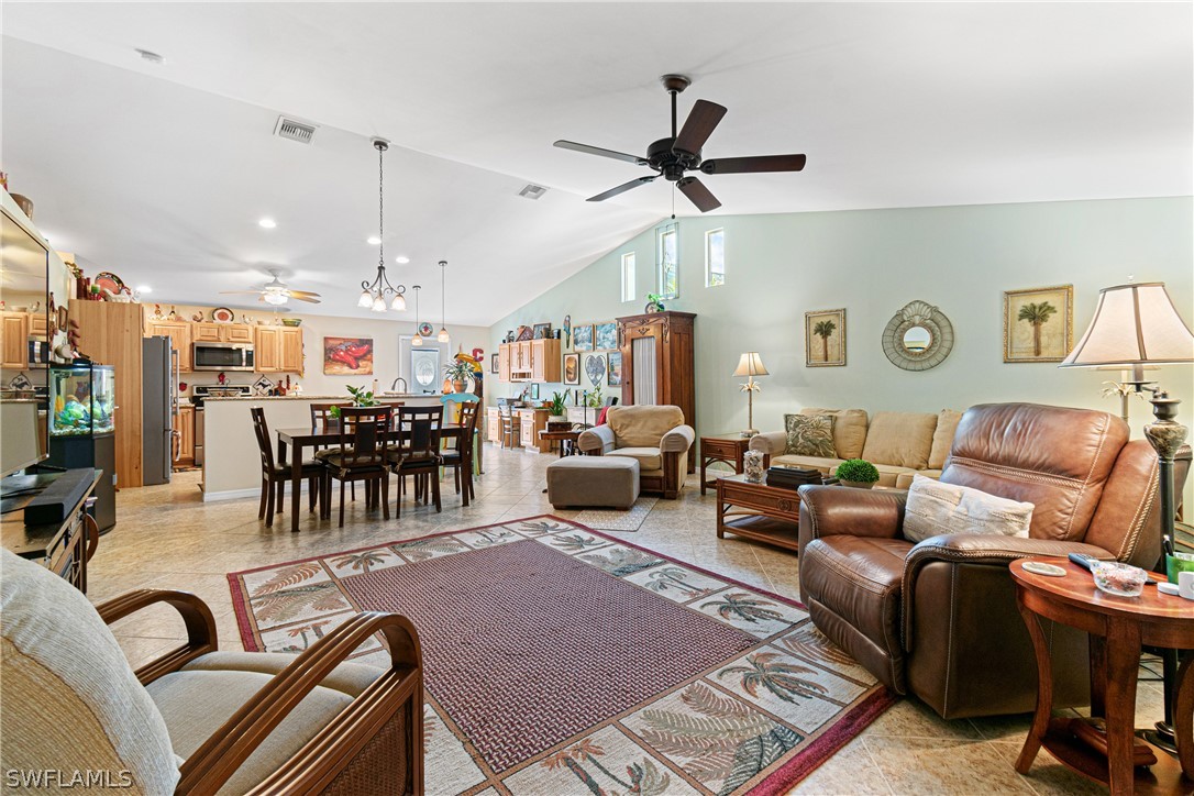 9701 Baycrest Terrace Lehigh Acres, FL 33936 - Photo 15 of 50 a living room with furniture and wooden floor