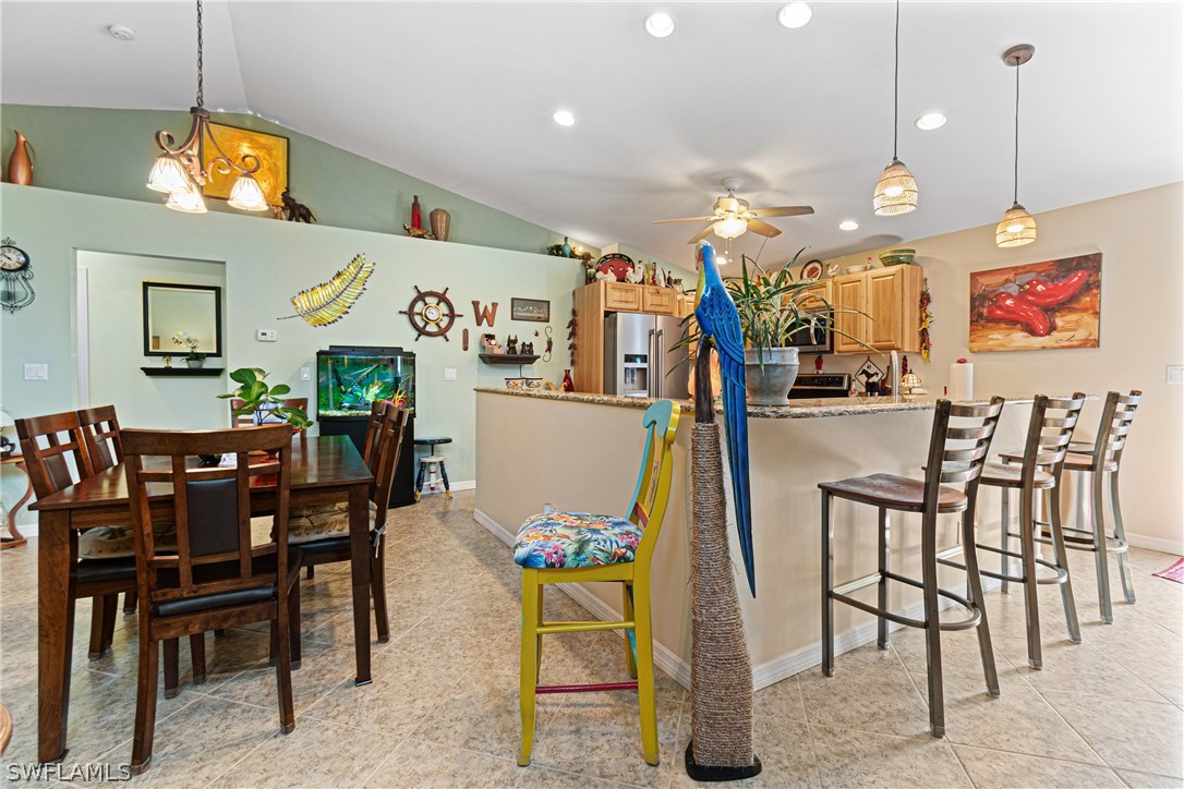 9701 Baycrest Terrace Lehigh Acres, FL 33936 - Photo 26 of 50 a view of a dining area with furniture