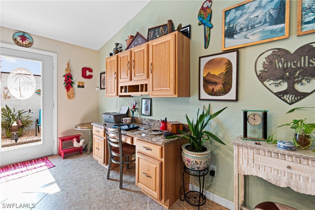 9701 Baycrest Terrace Lehigh Acres, FL 33936 - Photo 29 of 50 a living room with furniture and a potted plant
