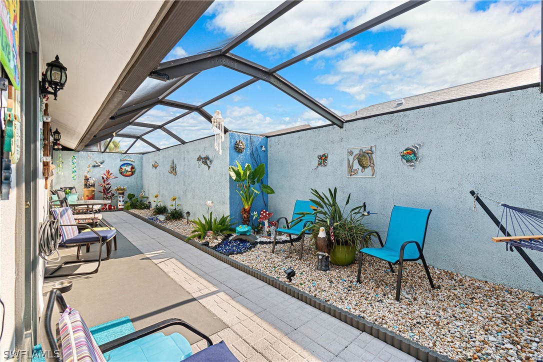 9701 Baycrest Terrace Lehigh Acres, FL 33936 - Photo 32 of 50 a view of an chairs and table in the balcony