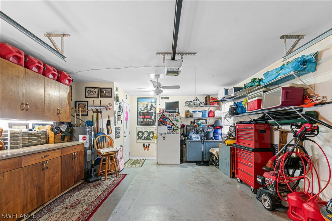 9701 Baycrest Terrace Lehigh Acres, FL 33936 - Photo 38 of 50 a view of a storage room with a lot of stuff