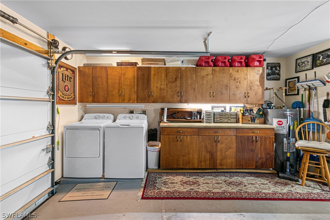 9701 Baycrest Terrace Lehigh Acres, FL 33936 - Photo 39 of 50 a utility room with washer and dryer