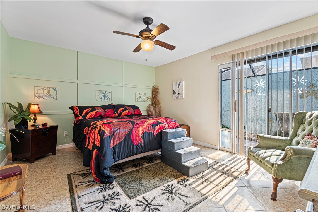 9701 Baycrest Terrace Lehigh Acres, FL 33936 - Photo 43 of 50 a bedroom with a bed and wooden floor