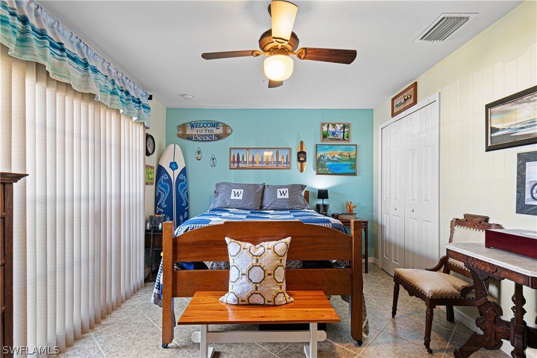 9701 Baycrest Terrace Lehigh Acres, FL 33936 - Photo 50 of 50 a bedroom with furniture and a window