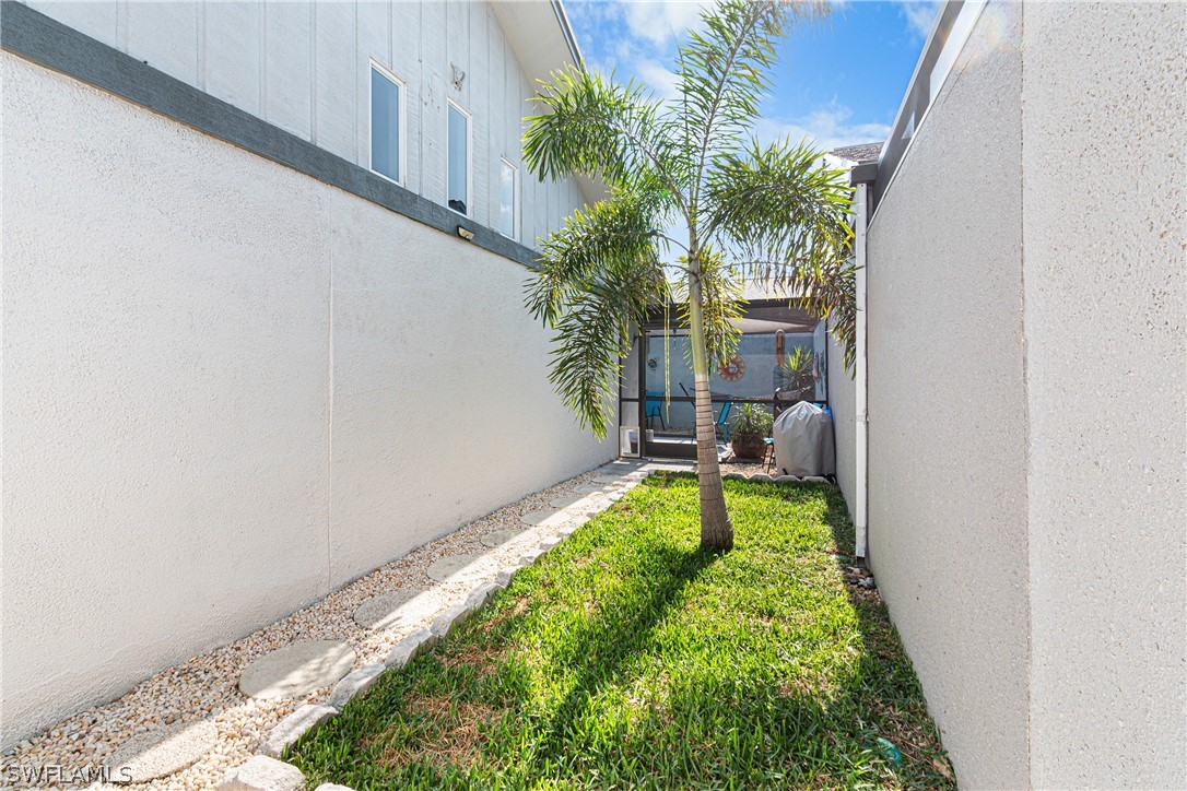 9701 Baycrest Terrace Lehigh Acres, FL 33936 - Photo 9 of 50 a view of yard with patio
