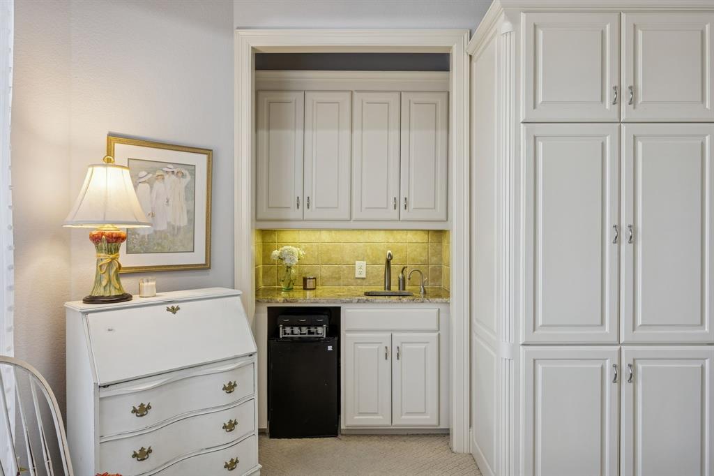 1520 Snider Court Lucas, TX 75002 - Photo 22 of 40 Wet Bar in second primary suite, or MIL suite, features mini-fridge, sink and quality cabinetry.