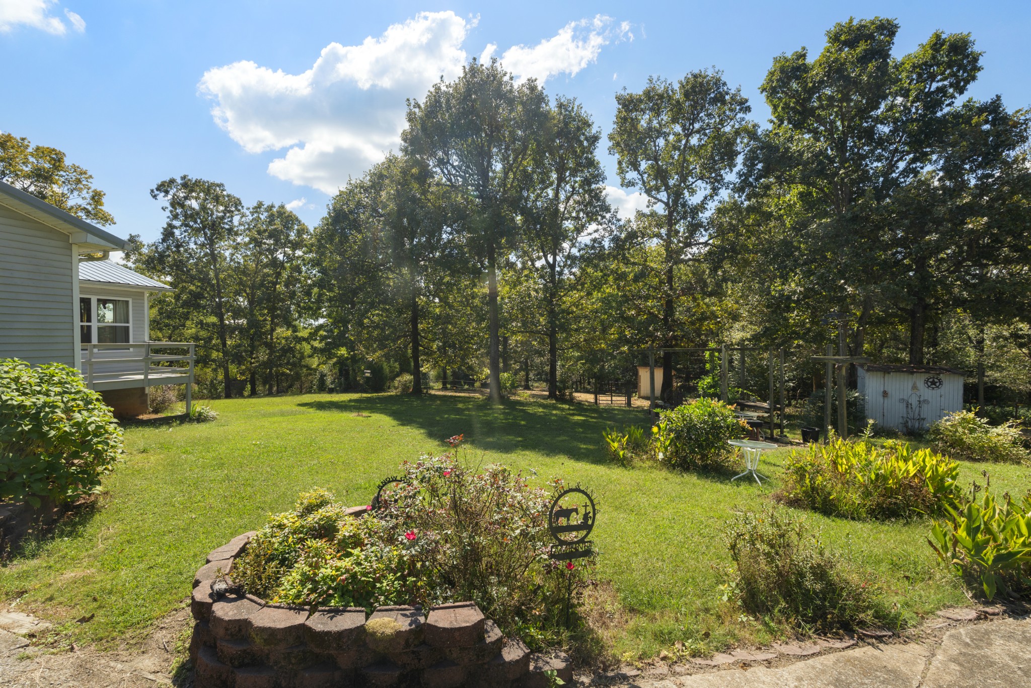 3859 Erin Road McEwen, TN 37101 - Photo 11 of 52 a view of a garden with lawn chairs