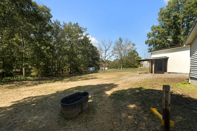 a view of a yard with an outdoor space