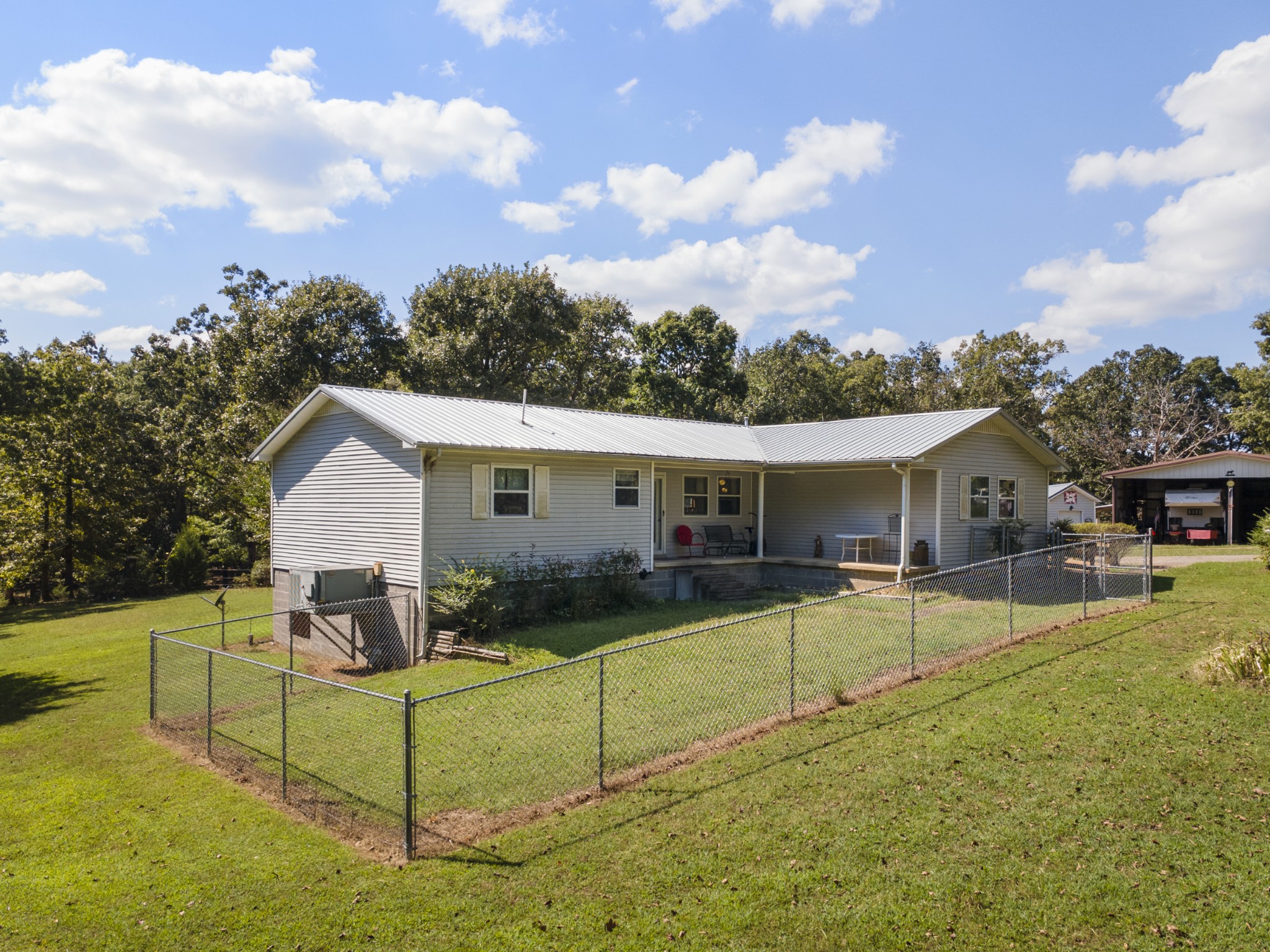 3859 Erin Road McEwen, TN 37101 - Photo 16 of 52 a view of a house with backyard and sitting area
