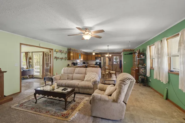 a view of a livingroom with furniture window and wooden floor