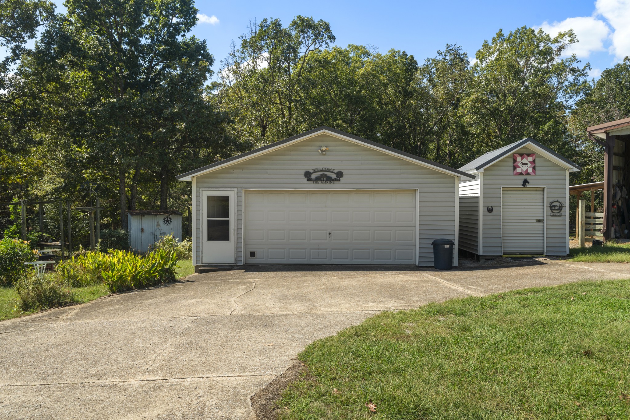 3859 Erin Road McEwen, TN 37101 - Photo 3 of 52 a front view of a house with a yard and garage