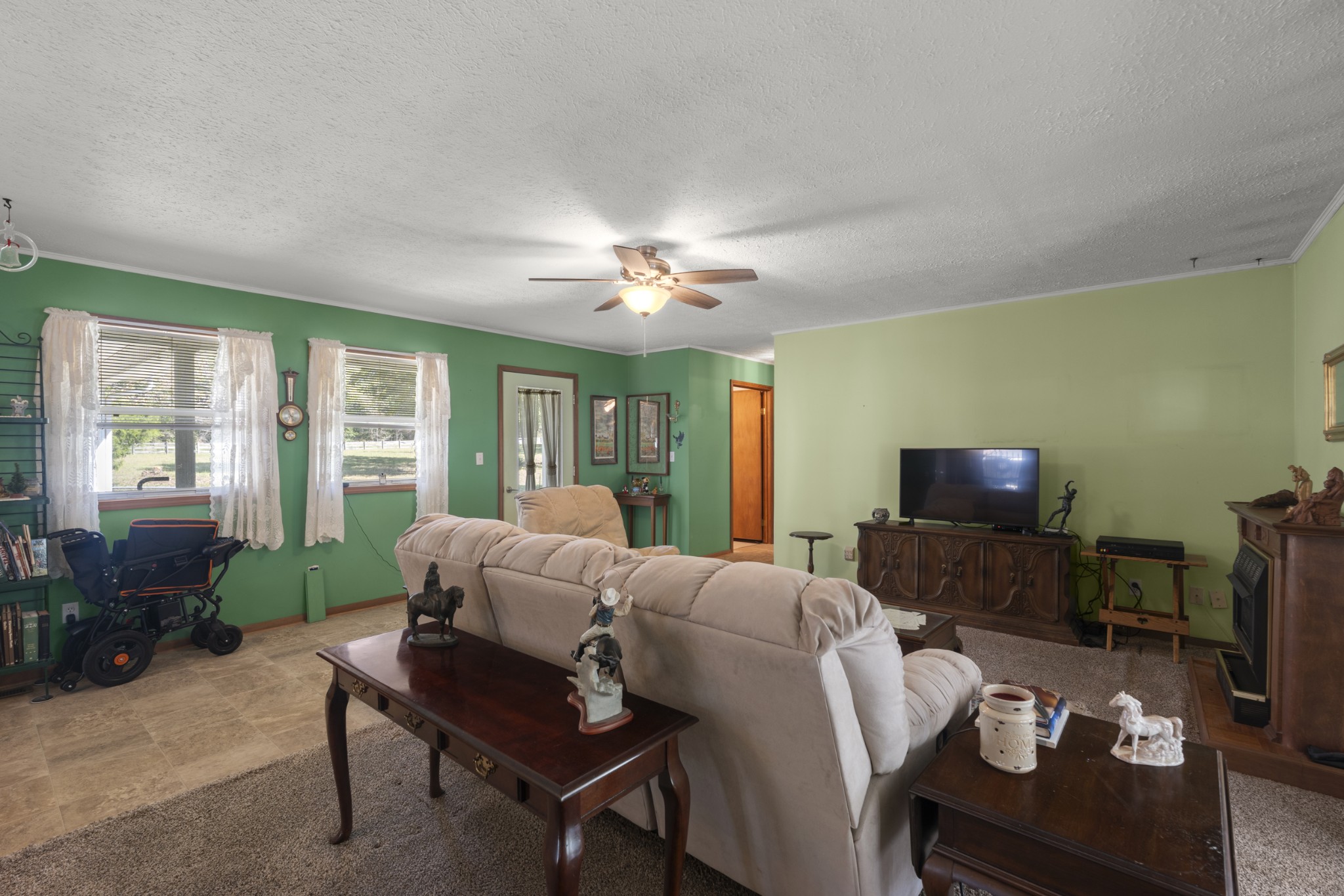 3859 Erin Road McEwen, TN 37101 - Photo 32 of 52 a living room with furniture a window and a flat screen tv
