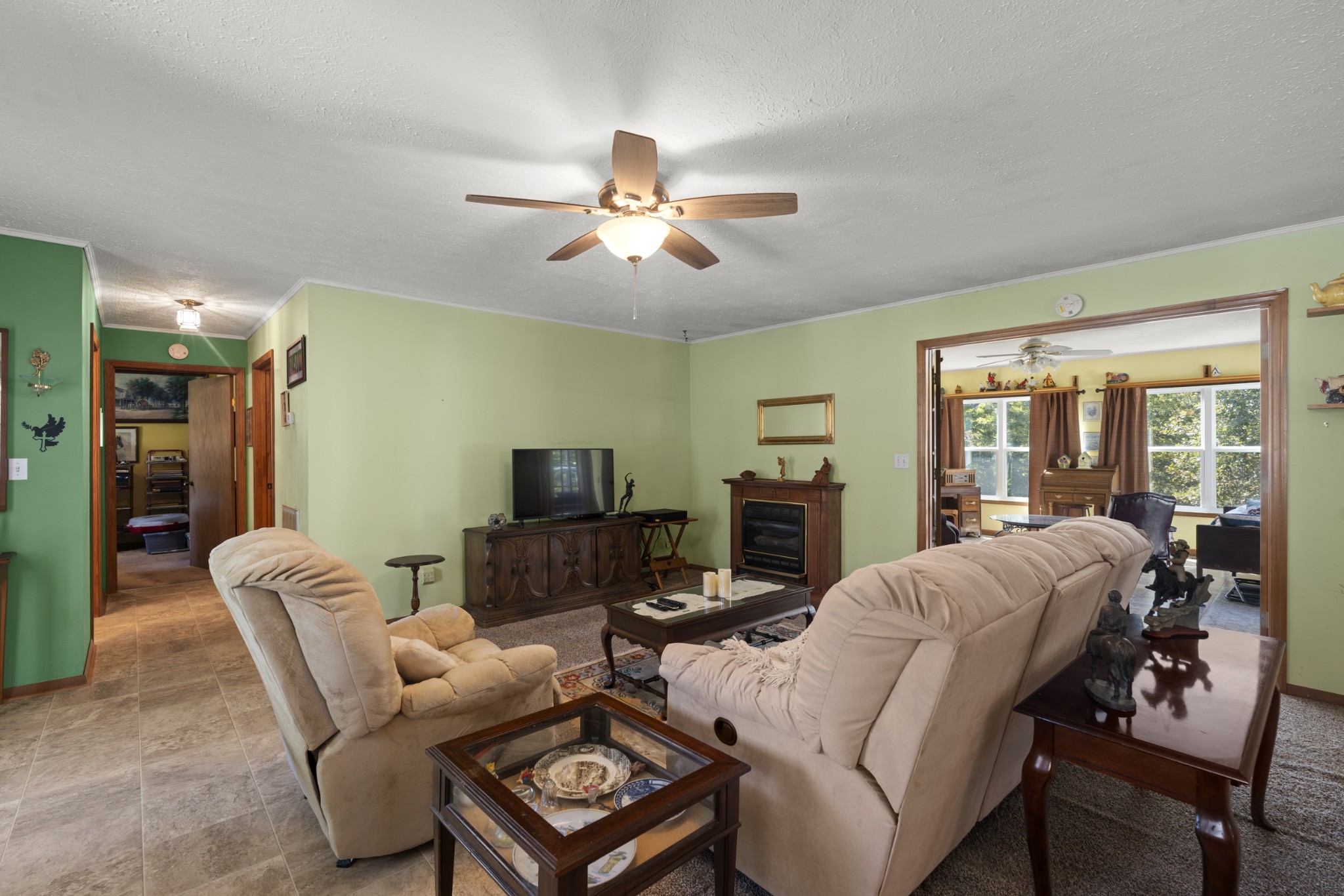 3859 Erin Road McEwen, TN 37101 - Photo 33 of 52 a living room with furniture a ceiling fan and a window