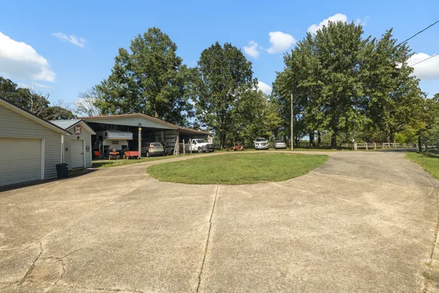 a view of house with yard outdoor seating and entertaining space