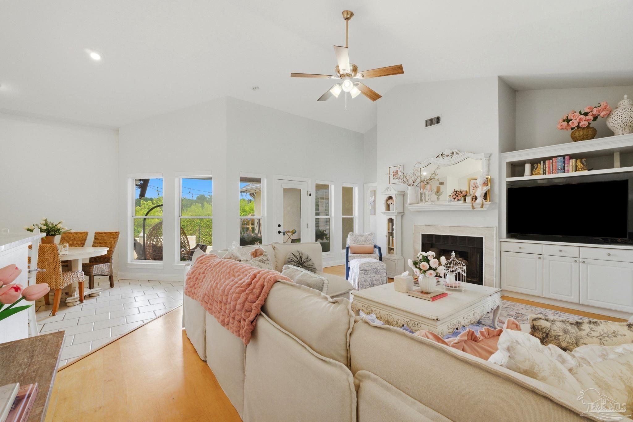 5931 Otter Point Road Pensacola, FL 32504 - Photo 10 of 67 a living room with furniture fireplace and flat screen tv