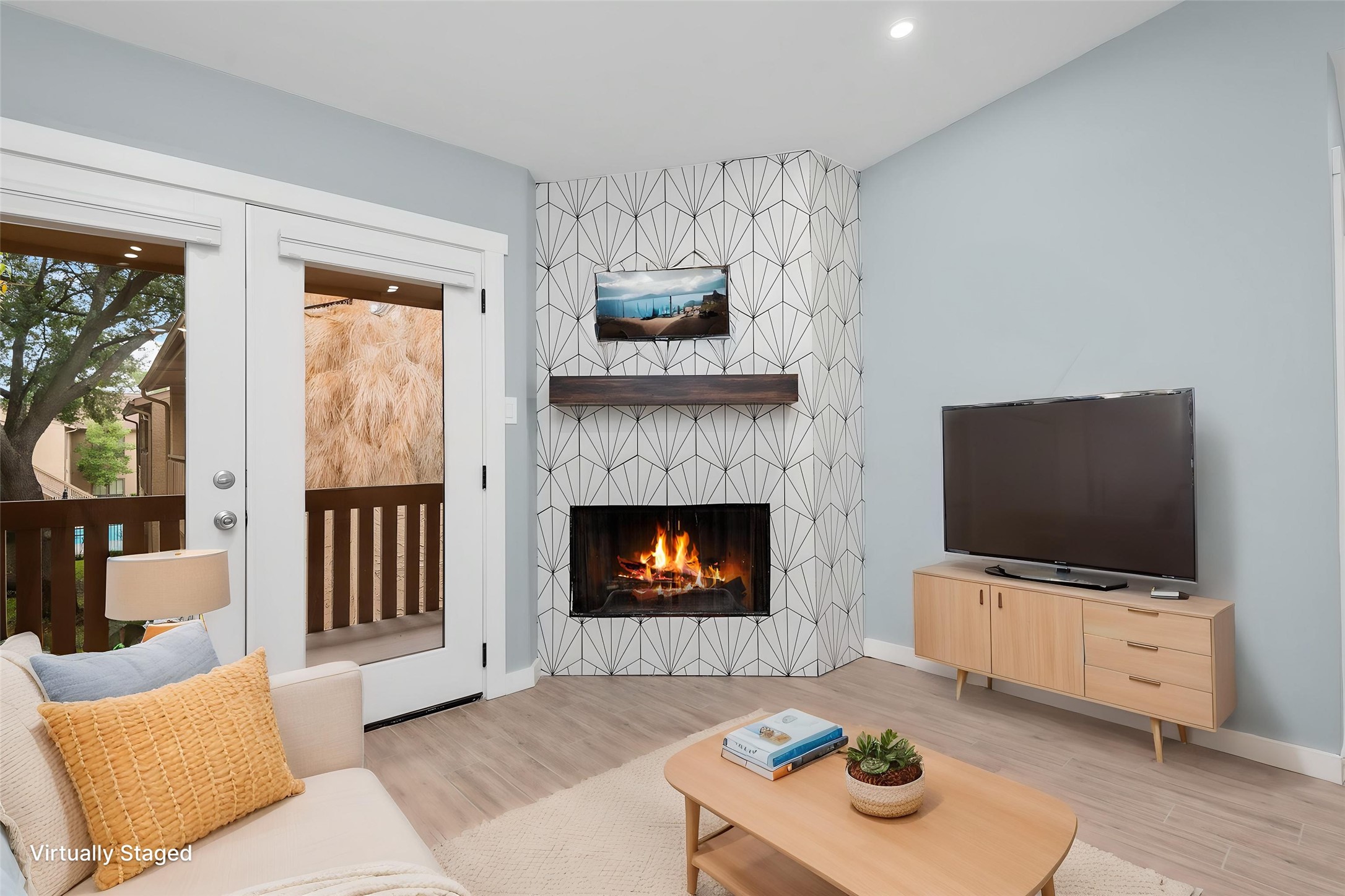 5000 Milwee Street, Unit 54 Houston, TX 77092 - Photo 6 of 25 A redesigned fireplace as the heart of the home — the perfect backdrop for cozy evenings in. Virtually staged.
