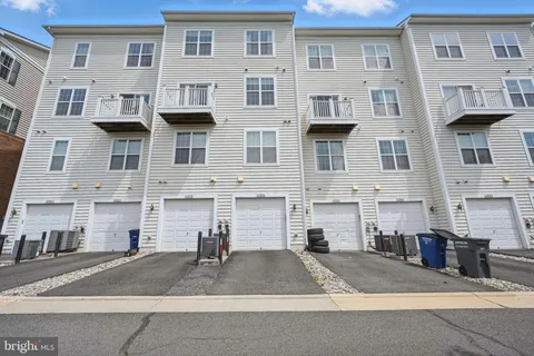 a front view of a building with a street