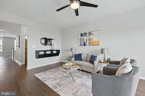 a living room with furniture and a rug