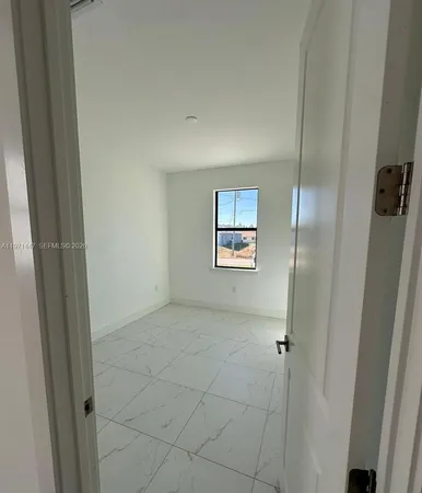 a view of a hallway with a glass door