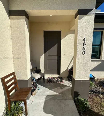 a kitchen with stainless steel appliances a stove a sink and a refrigerator