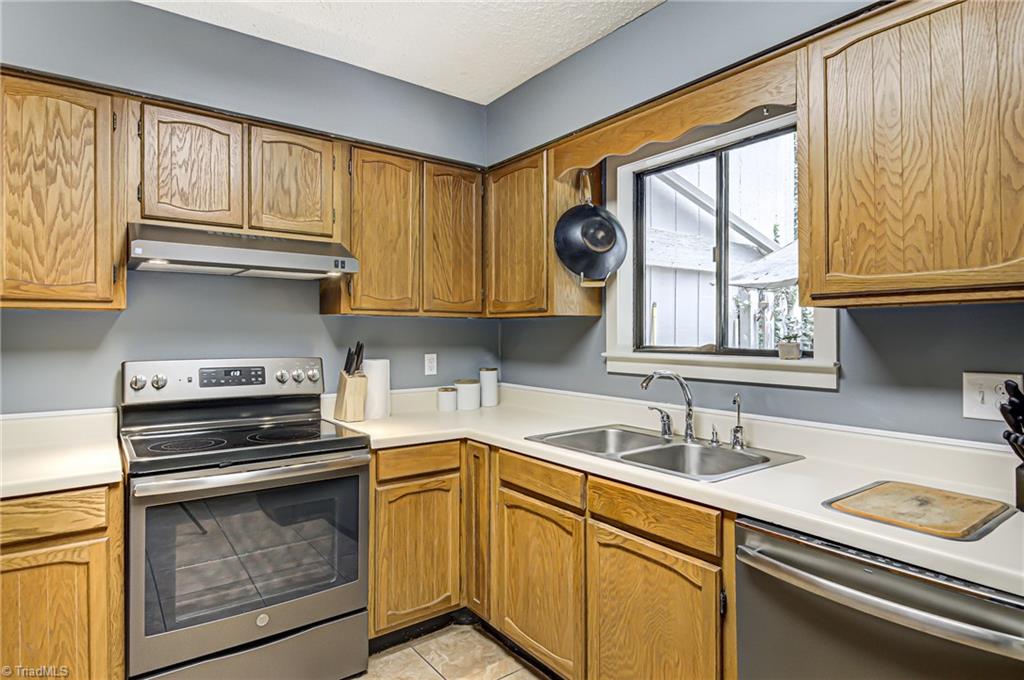 236 Northpoint Avenue, Unit F High Point, NC 27262 - Photo 10 of 25 Brand new vent hood! The window shows a gorgeous view of the back patio and garden!