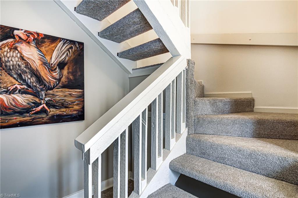 236 Northpoint Avenue, Unit F High Point, NC 27262 - Photo 12 of 25 Stairs leads to second floor bedrooms. Brand new carpet and fresh paint upstairs!