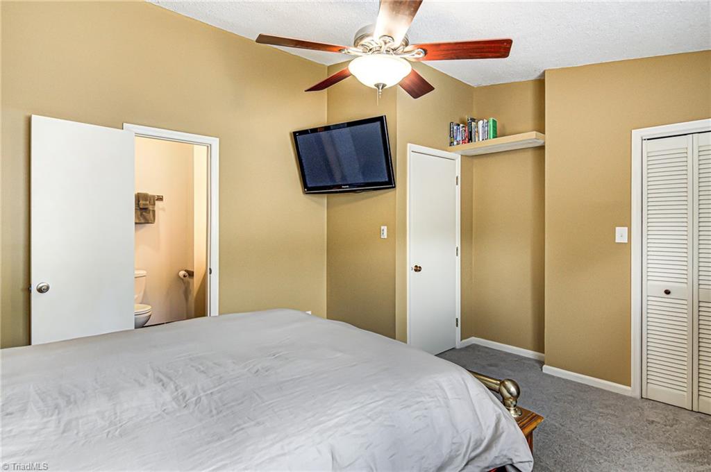 236 Northpoint Avenue, Unit F High Point, NC 27262 - Photo 14 of 25 Alternate view of the master bedroom with en suite bath! Folding doors on the right lead to a nice size closet.