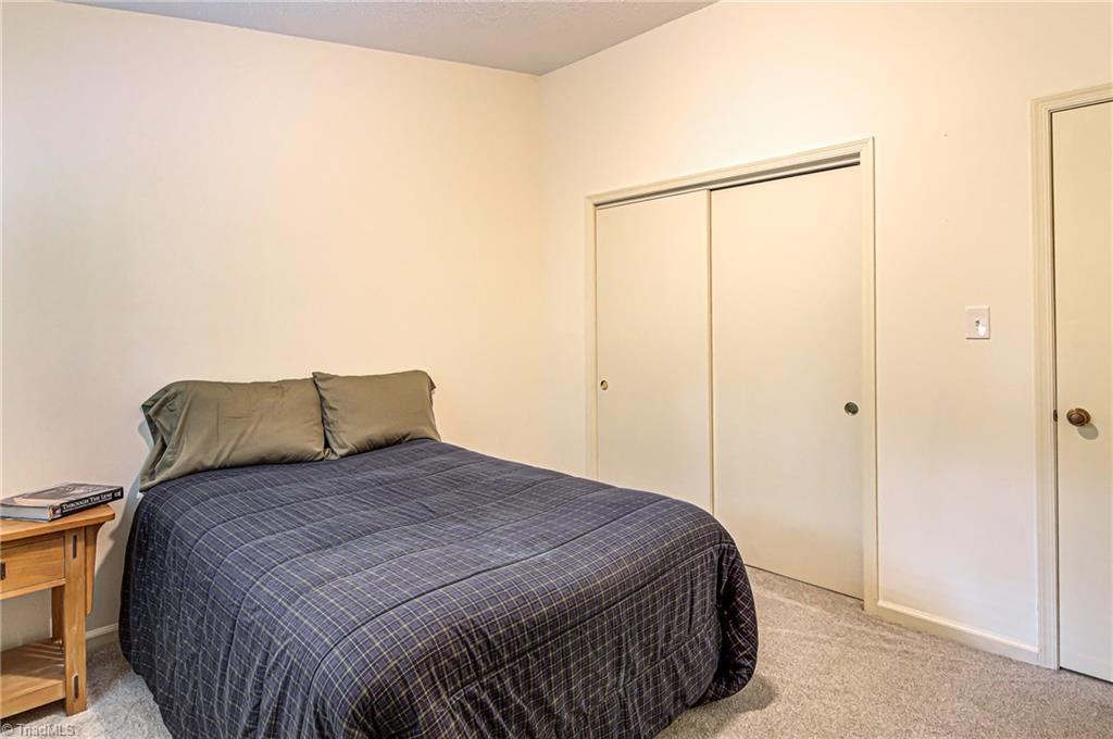 236 Northpoint Avenue, Unit F High Point, NC 27262 - Photo 17 of 25 The second bedroom is a great size with a sliding door closet.