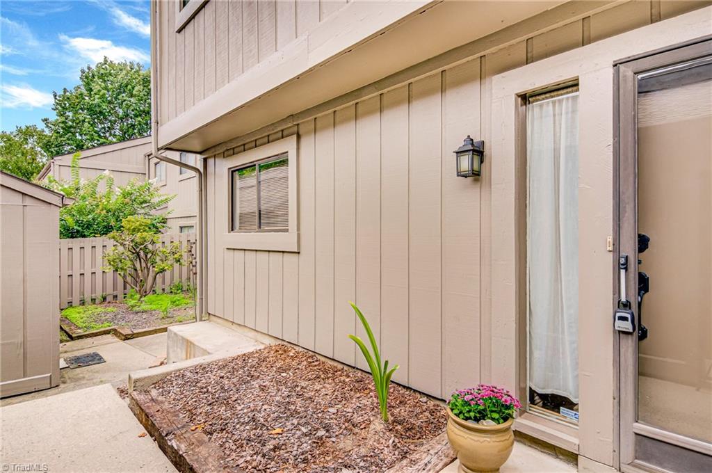Small garden area to the left of the front door.