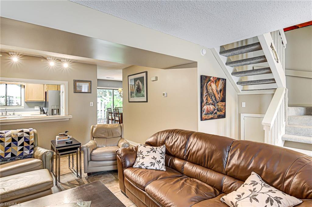 236 Northpoint Avenue, Unit F High Point, NC 27262 - Photo 24 of 25 Note the tile floors! The stairway on the right leads to the 3 bedrooms on the second floor. This floor plan flows easily from the living room to the dining room!