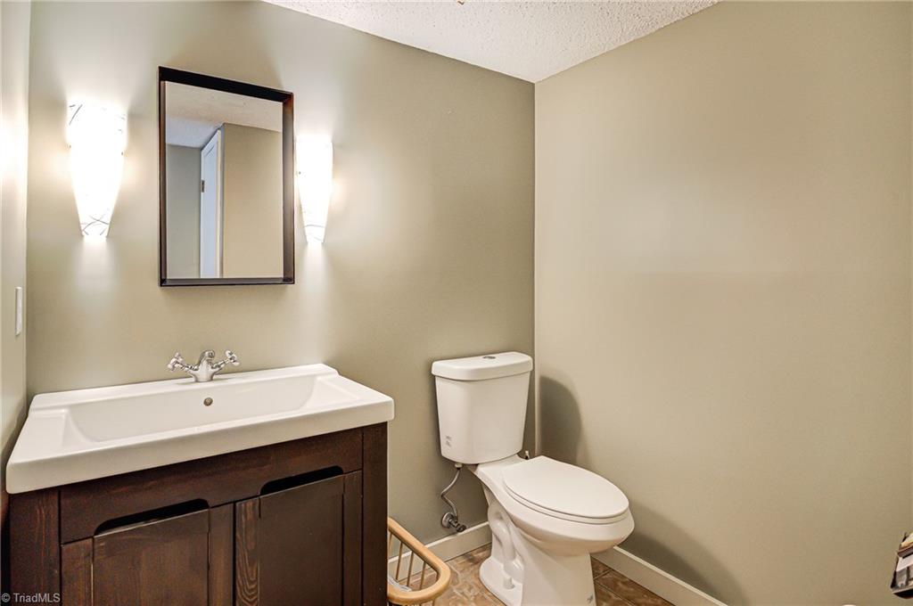 236 Northpoint Avenue, Unit F High Point, NC 27262 - Photo 8 of 25 The half bath is on the main floor by the dining room and has an over-sized sink with plenty of storage space!