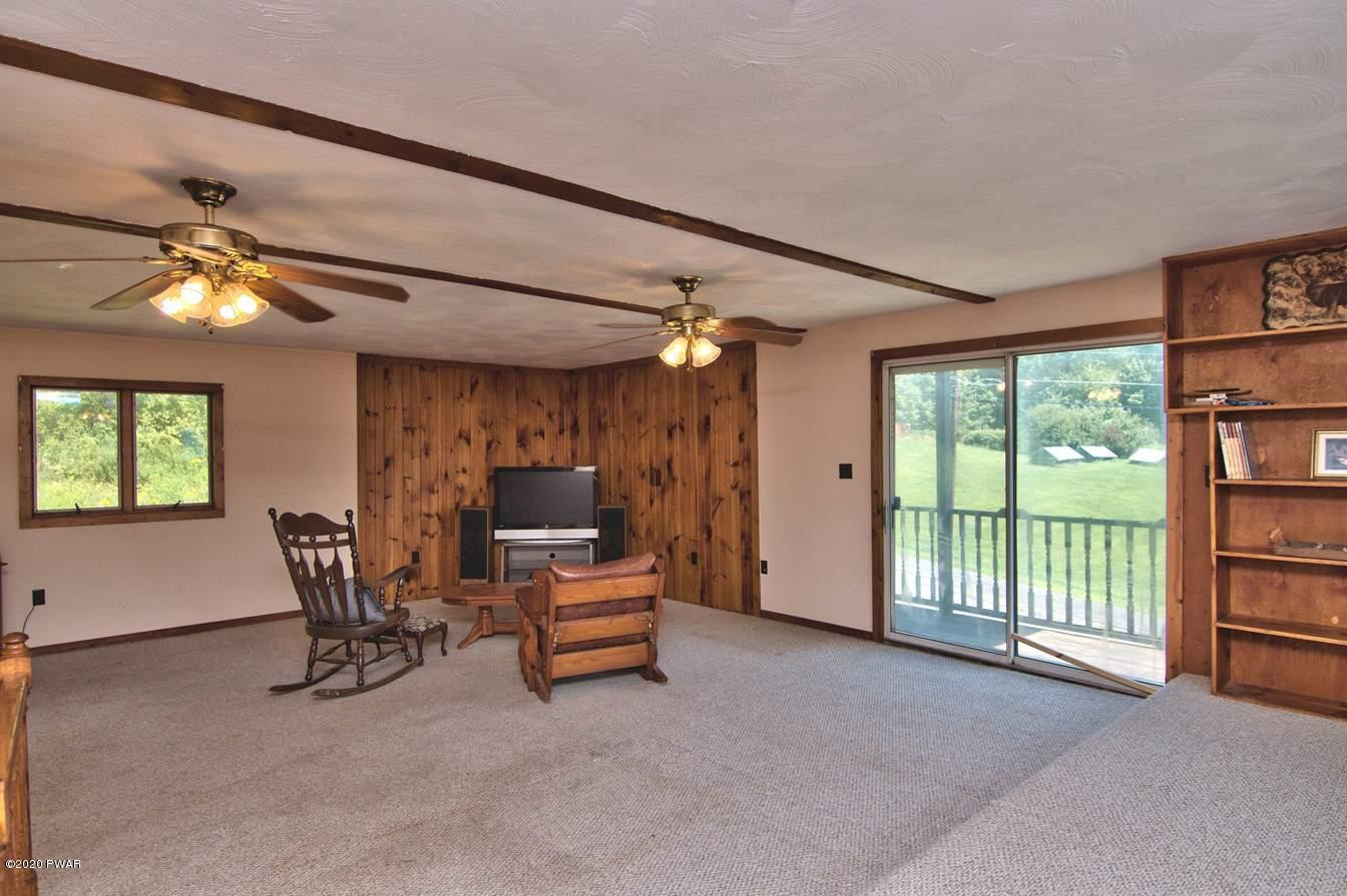5690 Haas Pond Road Moscow, PA 18444 - Photo 47 of 79 a view of workspace with furniture and chandelier