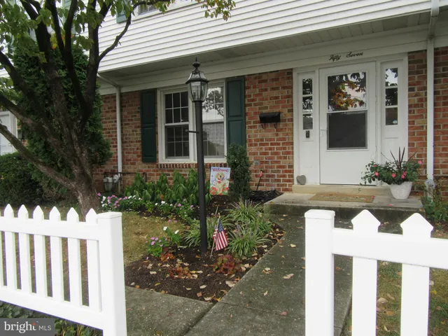 a front view of a house with a porch