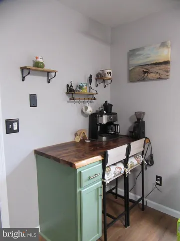 a dining room with a table and chairs